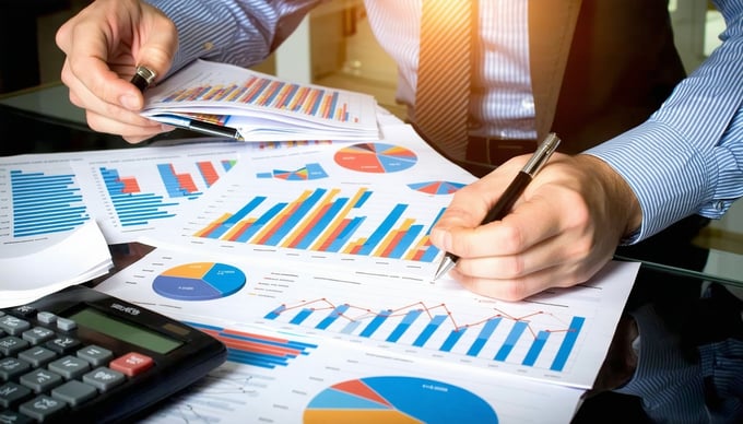 A small business owner analyzing financial documen